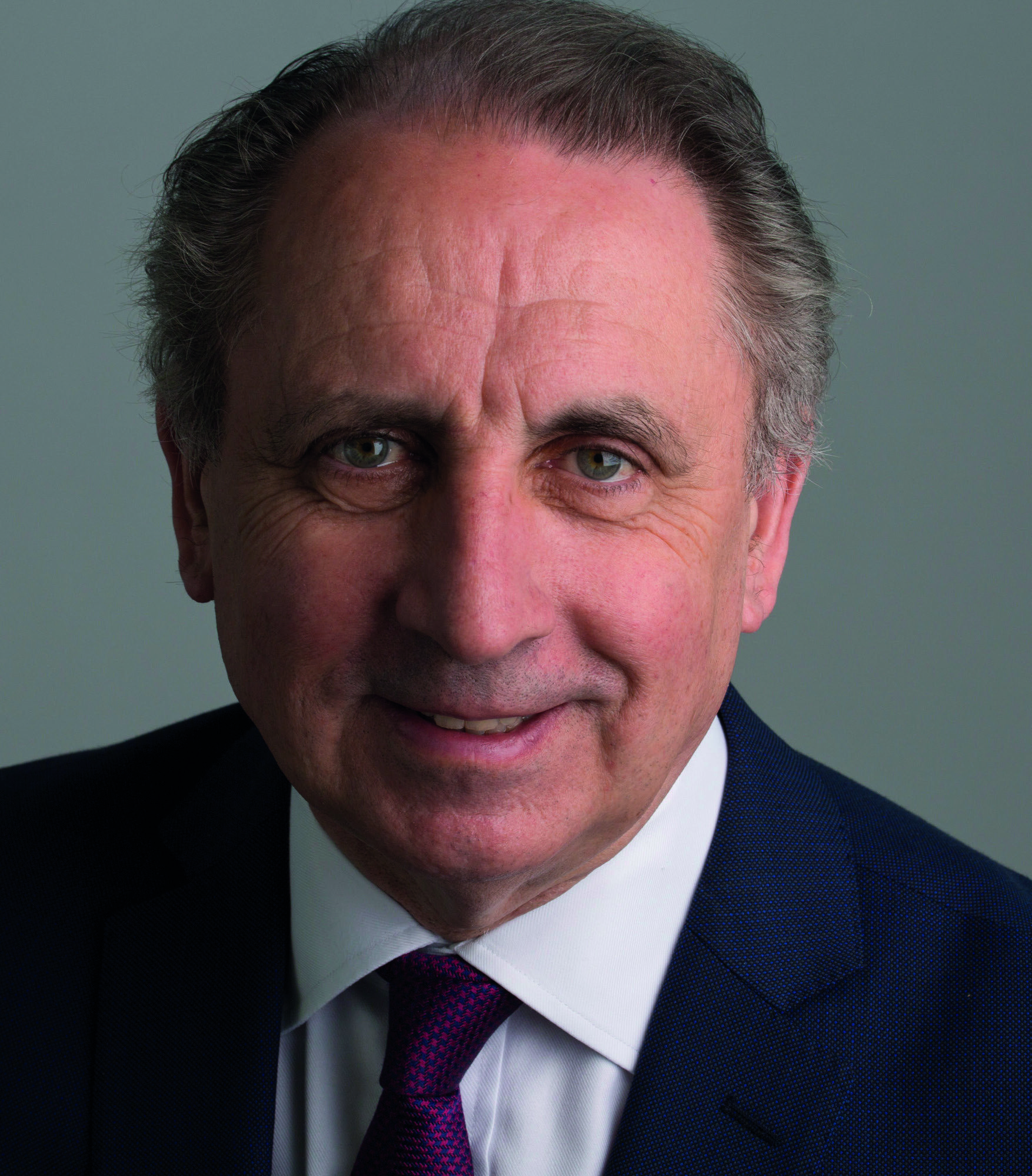 Headshot of Stephen Haddrill, a middle-aged man with dark hair, in a suit.