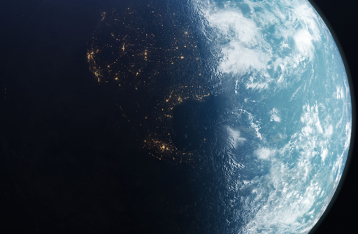 Earth from space, showing illuminated city lights on the night side and clouds over oceans on the sunlit side, indicating day and night.