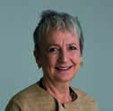 Headshot of an older woman with short grey hair and a slight smile.