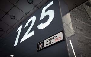 Street sign displaying "125 London Wall EC2", indicating a specific address in London.