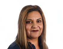 Headshot of a woman with long brown hair and dark lipstick smiling slightly.