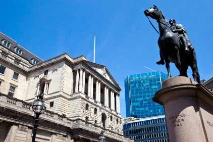 View of the Bank of England building with a horse statue in the foreground, London