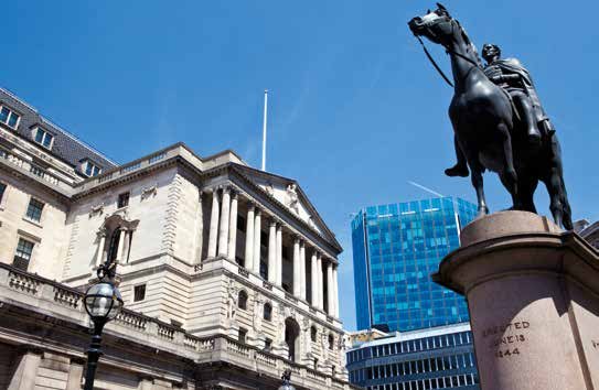 View of the Bank of England building and a statue of a horse and rider in London, with a modern skyscraper in the background.